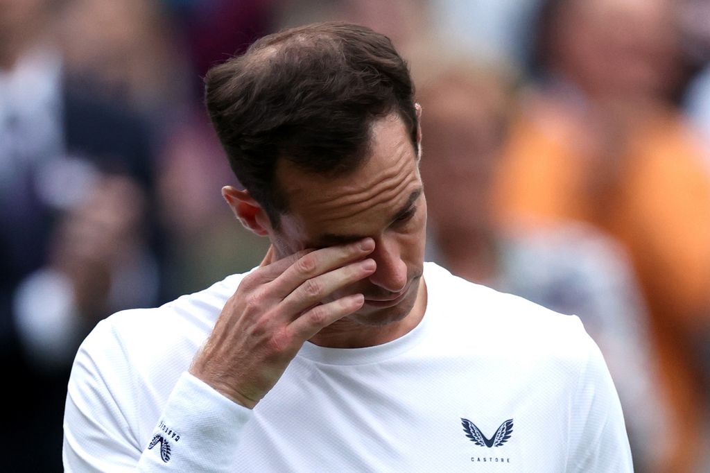 Andy Murray wiping a tear away from his face