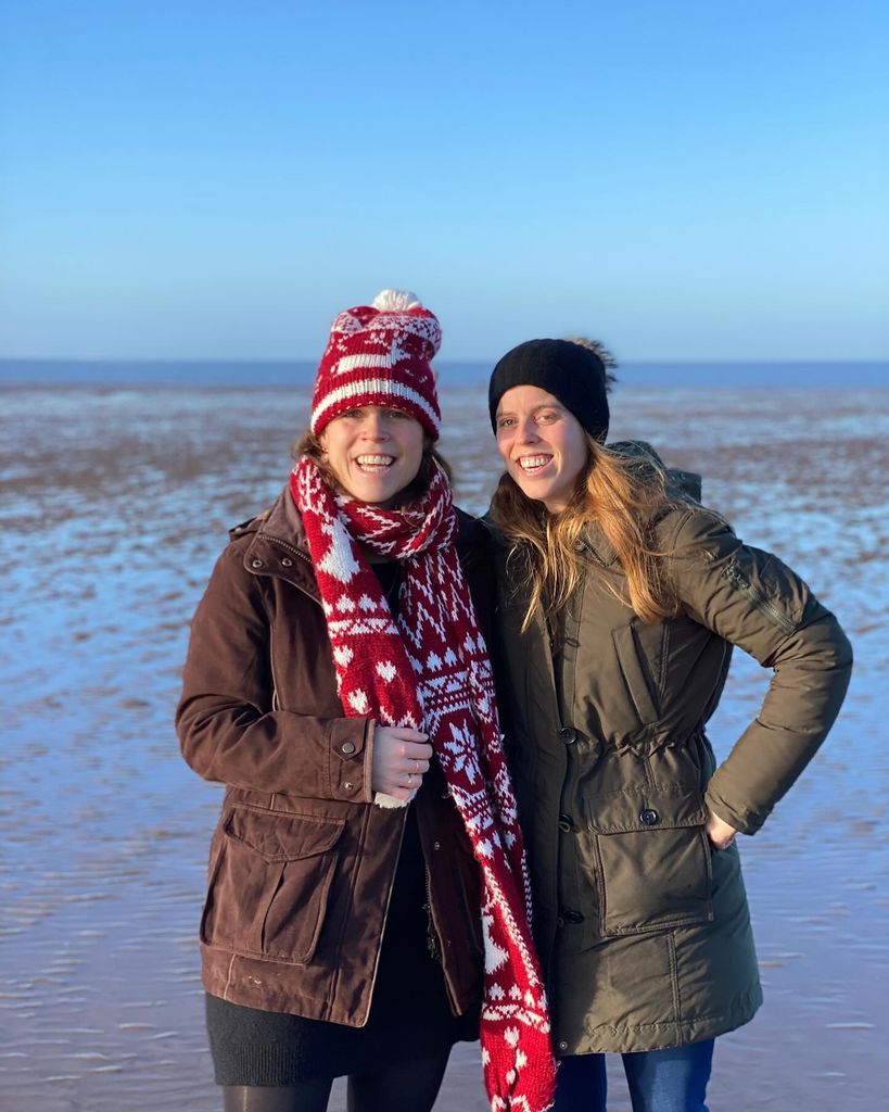 Eugenie and Beatrice smiling on beach in Norfolk at Christmas 2022