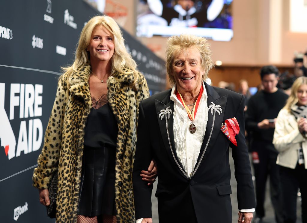 Penny Lancaster in a leopard-print coat and black mini skirt alongside Rod Stewart in a black suit