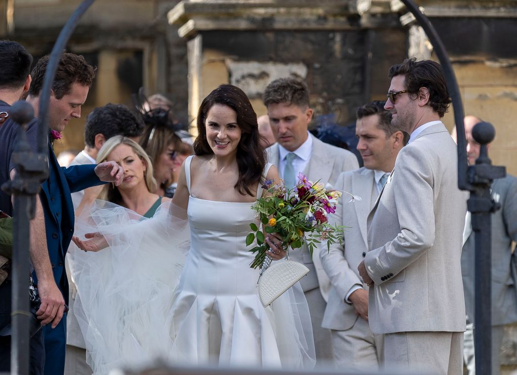 Laura Carmichael acts as a bridesmaid for Michelle Dockery as she ties the knot with Jasper Waller-Bridge
