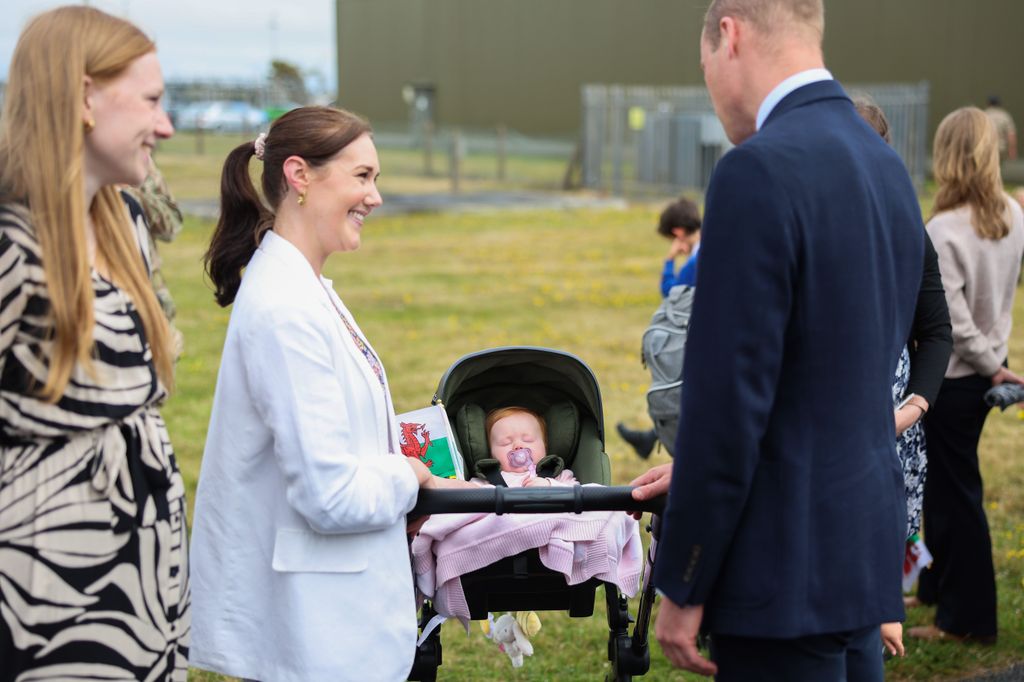 Prince William meets members of the public during an official visit at RAF Valley