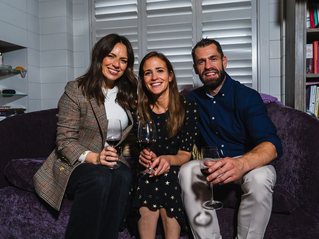 Liz Fletcher sitting with Amelia Singer and Kelvin Fletcher on a sofa