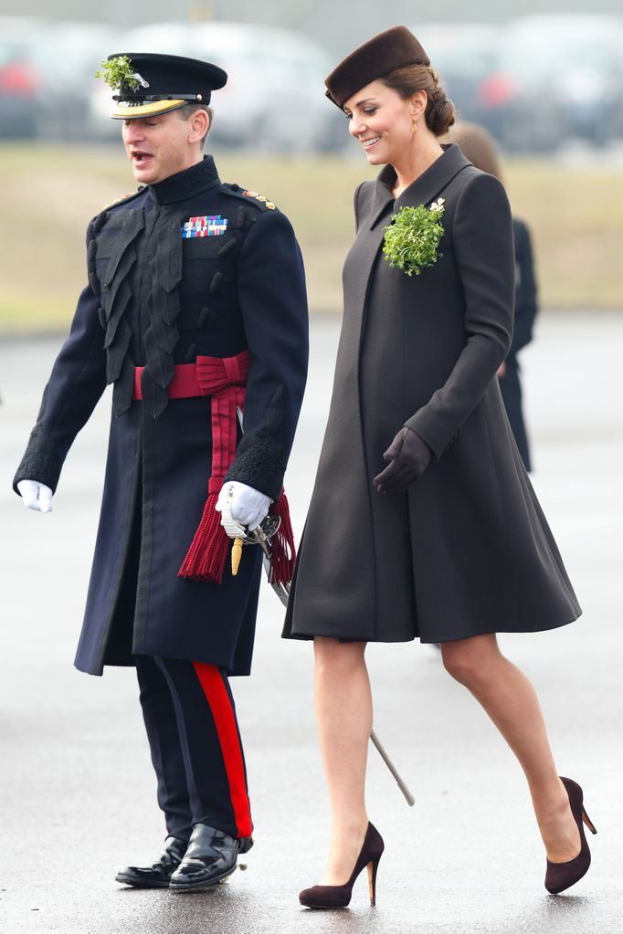 Catherine, Duchess of Cambridge attends the annual St Patrick's Day Parade at Mons Barracks on March 17, 2015 in brown