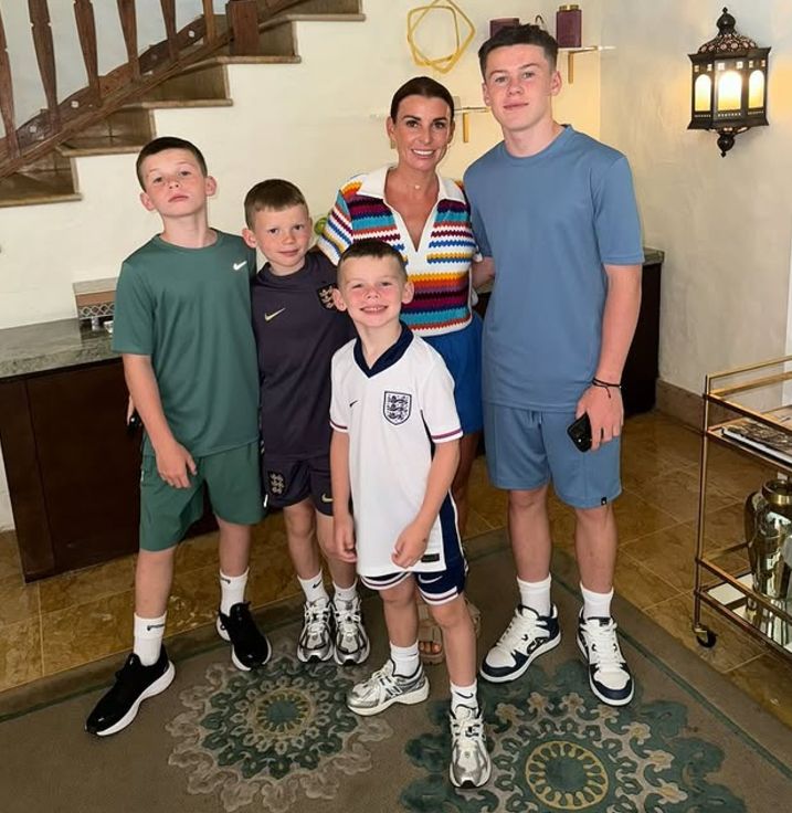 Coleen Rooney and her four sons inside a living room