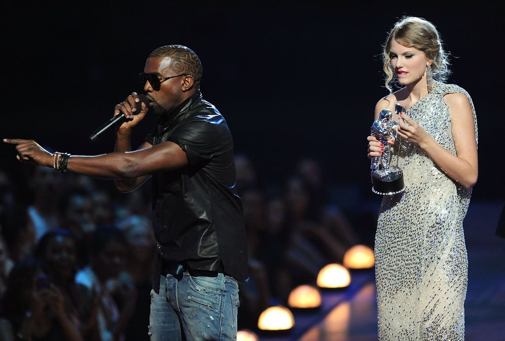 Kanye West takes the microphone from Taylor Swift and speaks onstage during the 2009 MTV Video Music Awards 