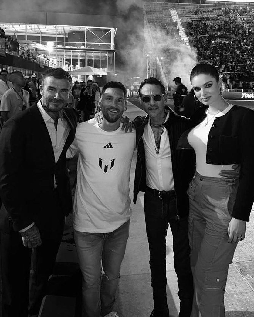 Marc Anthony, Nadia Ferreira, David Beckham and Lionel Messi in a black and white photo