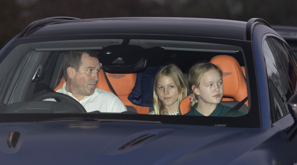Peter Phillips driving a car with Savannah and Isla Phillips