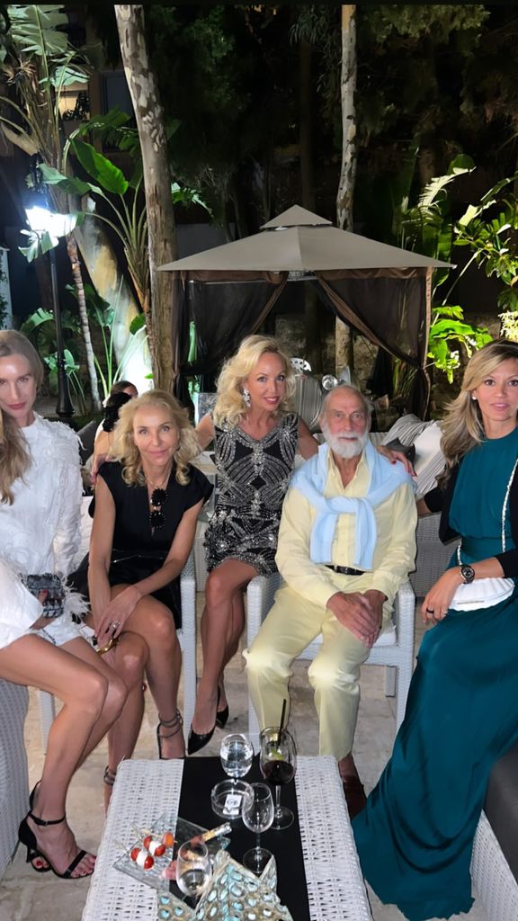 Prince Michael of Kent posing with friends at a party