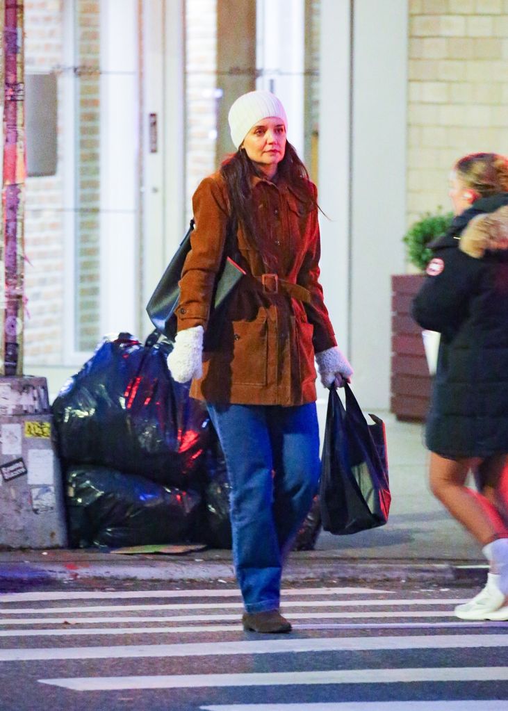 Katie Holmes appeared downcast strolling in NYC on January 4