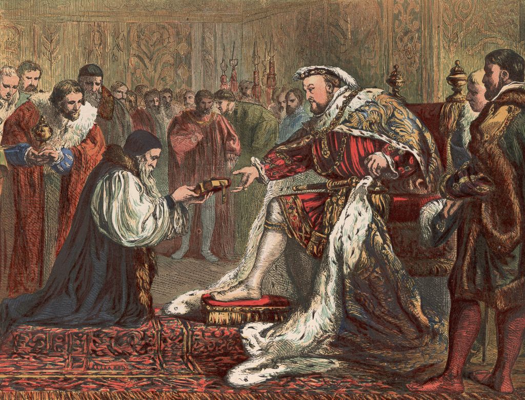 Circa 1535, English Protestant reformer Hugh Latimer (c.1485 - 1555) presents King Henry VIII (1491 - 1547) with a bible instead of the customary gift of a purse of gold