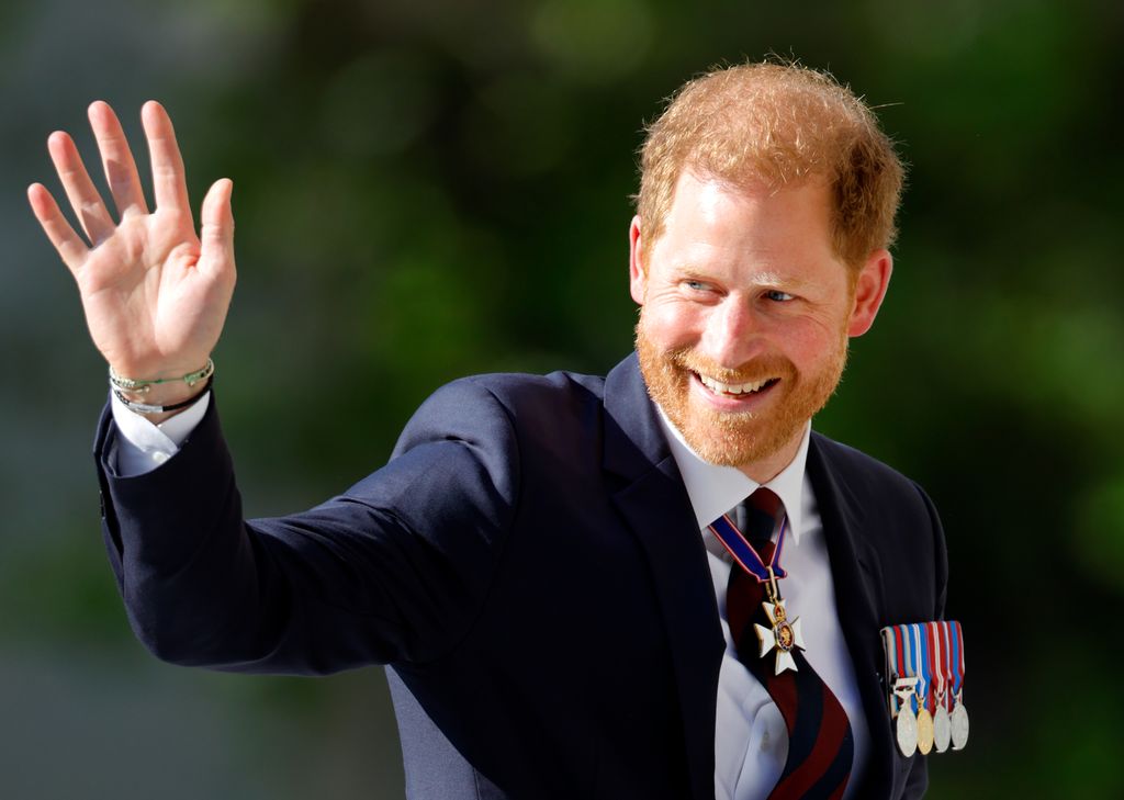 prince harry waving in suit 