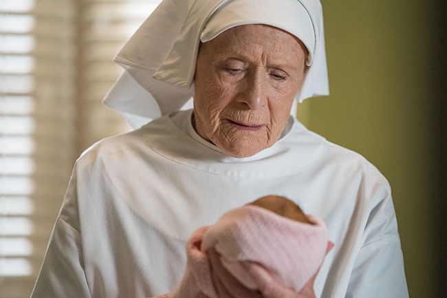 Sister Monica Joan looks at newborn baby in Call the Midwife