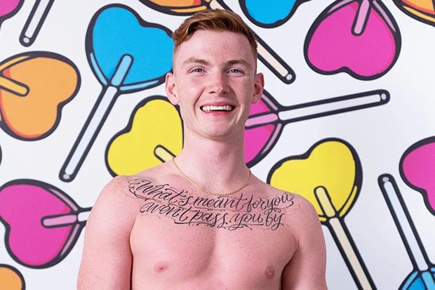 Jack shirtless with lollypop backdrop
