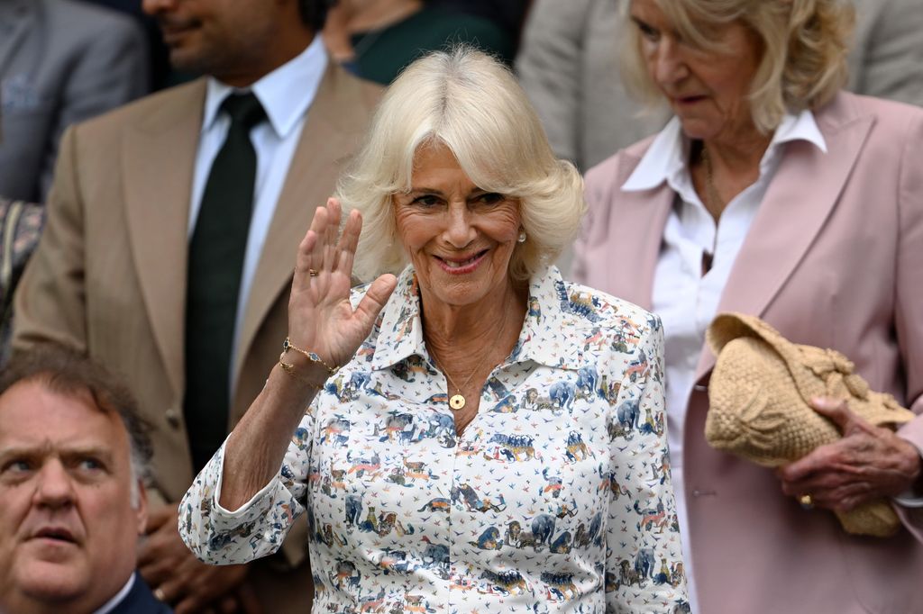 Queen Camilla waving from royal box at Wimbledon