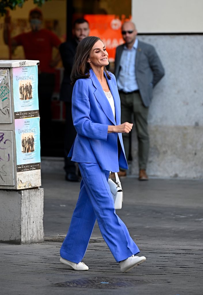 Queen Letizia walking in a new indigo blue suit