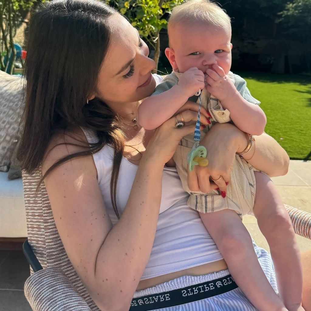 sister holding baby brother