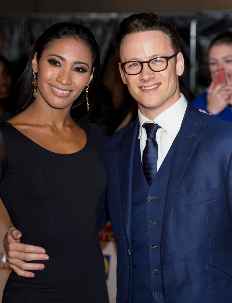 Karen Hauer in a black dress with Kevin Clifton in a blue suit