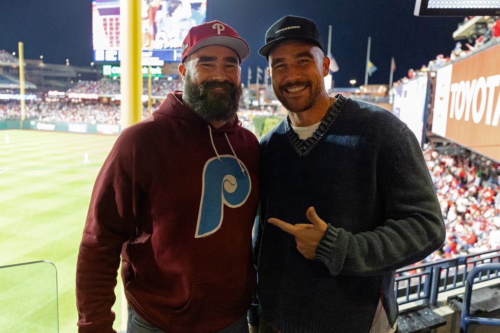 Jason and Travis Kelce pose for a photo during Game 1 of the NLCS between the Arizona Diamondbacks and the Philadelphia Phillies at Citizens Bank Park 