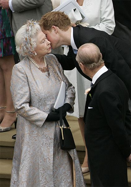 Prince Harry gives the Queen a kiss at a wedding