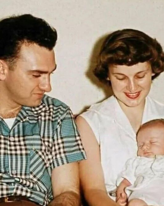 Madonna's parents with her as a baby