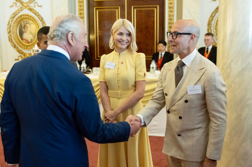 King Charles III meets Holly Willoughby and Stanley Tucci and he hosts the winners of the Prince's Trust awards and celebrity ambassadors at Buckingham Palace on May 17, 2023 in London, England