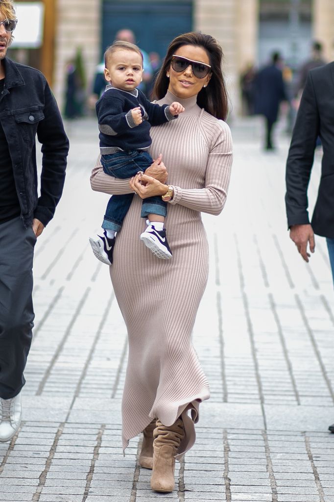 Eva Longoria carrying her son Santiago