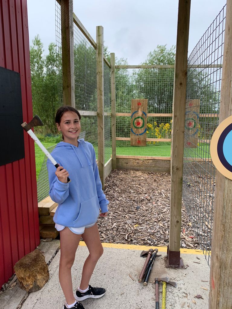 My daughter trying axe throwing