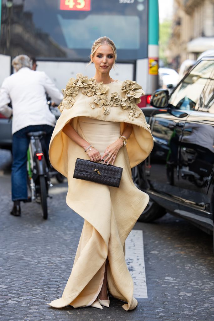 Leonie Hanne wears beige wrapped dress outside Stephane Rolland during the Haute Couture Fall/Winter 2024/2025 as part of  Paris Fashion Week on June 25, 