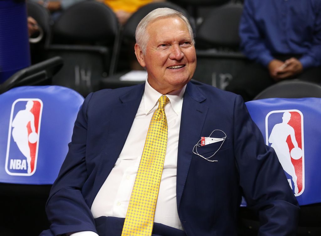 Golden State Warriors executive board member Jerry West sits on the bench by NBA logos before the game the Los Angeles Clippers at Staples Center on March 31, 2015 in Los Angeles, California