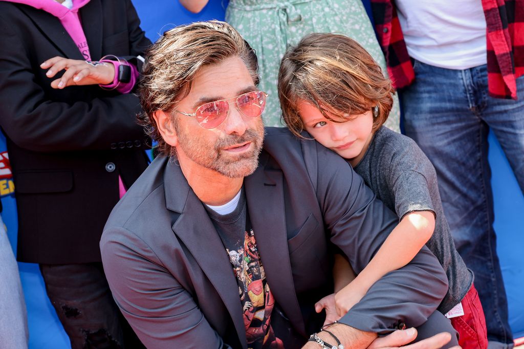 John Stamos and Billy Stamos attend Disney Junior's "Marvel's Spidey and His Amazing Friends" VIP event at Santa Monica Pier on August 27, 2022 in Santa Monica, California