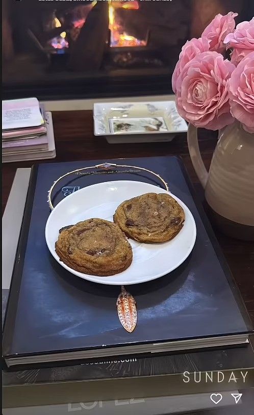 photo of cookies on a plate in front of fireplace in jennifer lopez house
