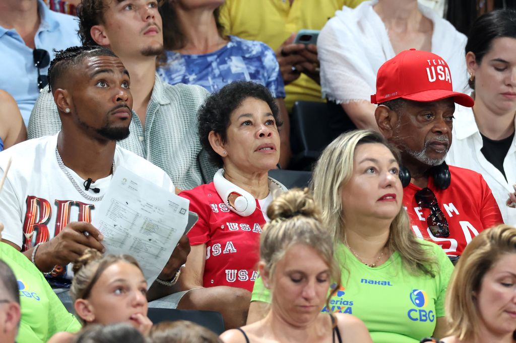 Family members of Simone Biles of Team United States, (L-R) her husband Jonathan Owens and parents Nellie and Ronald Biles look on during the Artistic Gymnastics Women's Team Final on day four of the Olympic Games Paris 2024 at Bercy Arena on July 30, 2024 in Paris, France