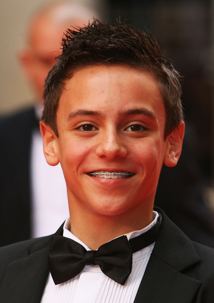 A young Tom Daley on a red carpet