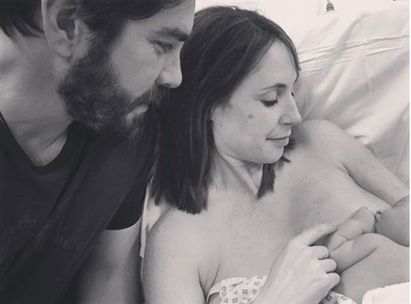 Alex Jones breastfeeding her son