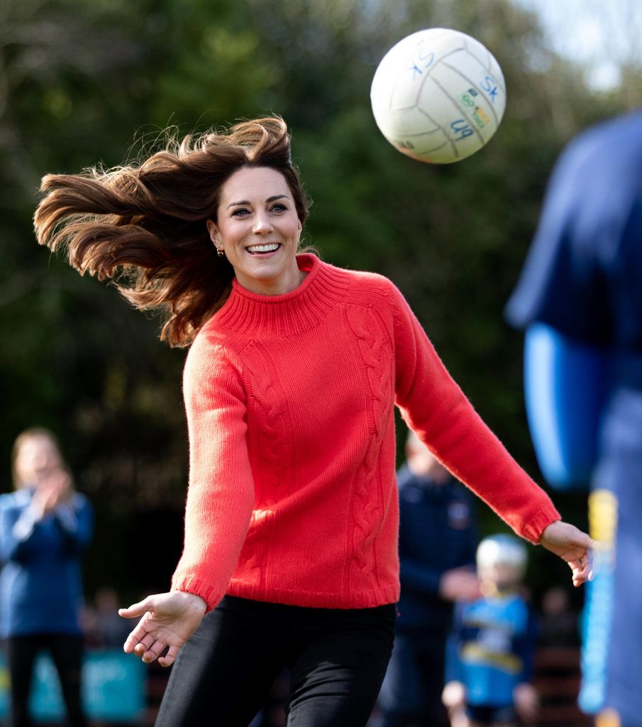 Princess Kate hair swinging as she plays football