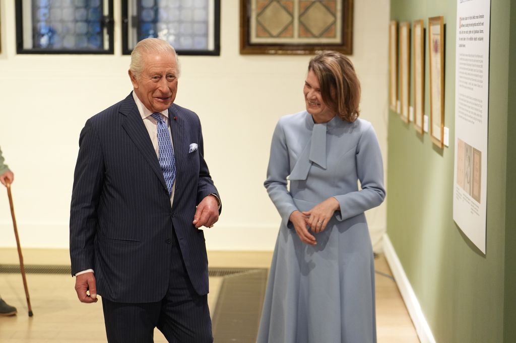 King Charles III with Aura Woodward, director of the Romanian Cultural Institute in London, at the Queen Marie of Romania exhibition at the Garrison Chapel on September 29, 2025 in London