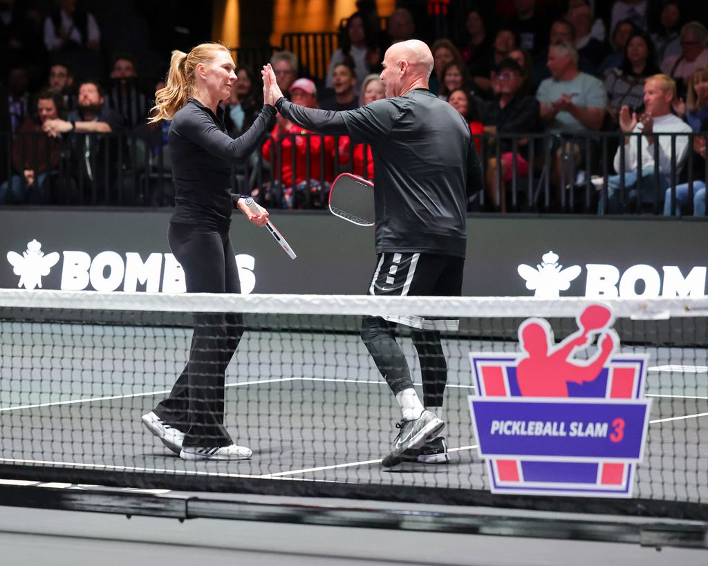 Steffi and Andre celebrate a point during the Pickleball Slam 3 in Las Vegas, Nevada 