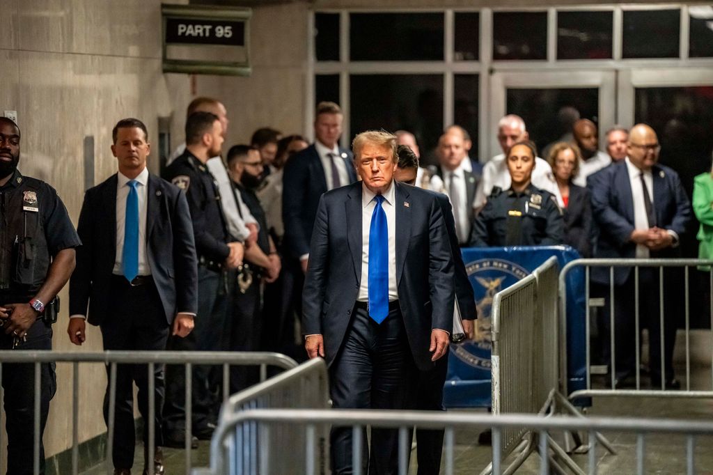 Donald Trump exits the courthouse after being found guilty following his hush money trial 