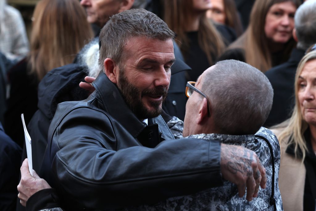 David Beckham sharing a hug with Greg Mounfield