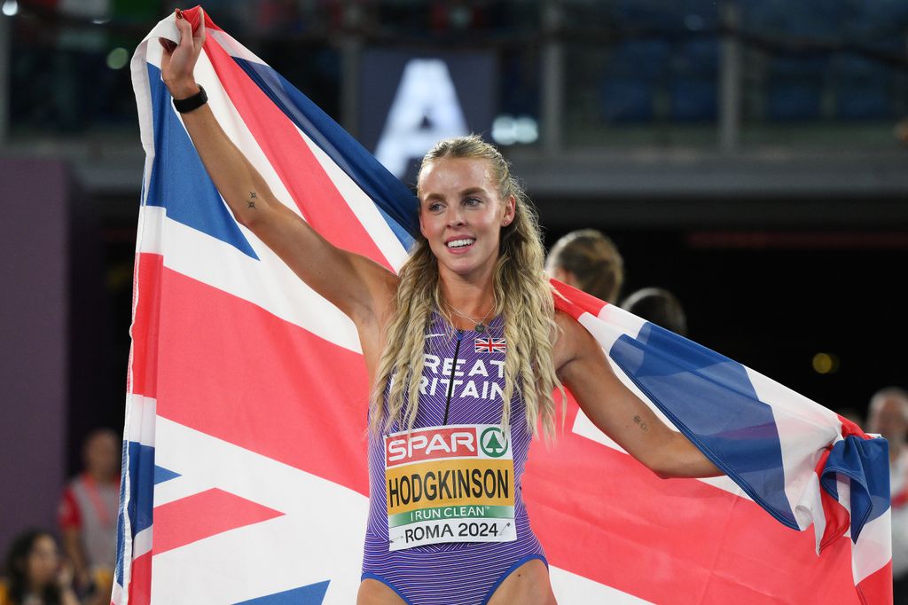 keely hodgkinson holding up union jack flag