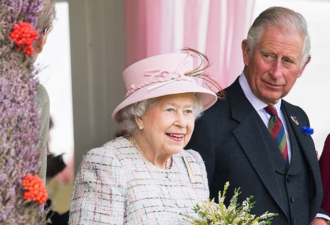 Charles looks over to Queen at Flower Show