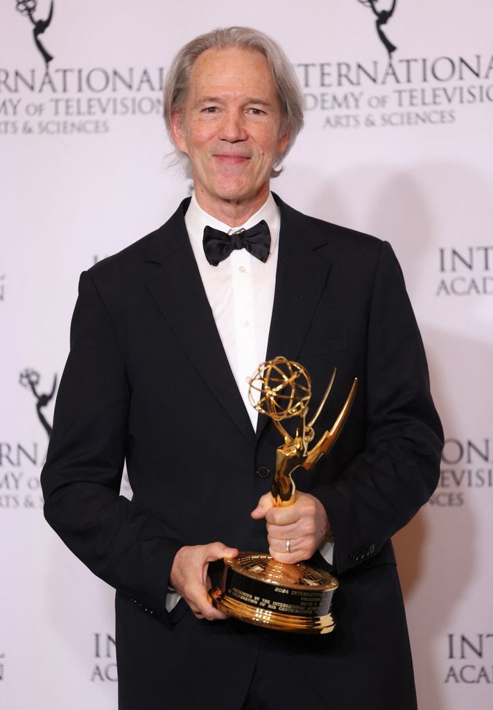 David E. Kelley poses with the Founders award in the press room of the 52nd International Emmy Awards 