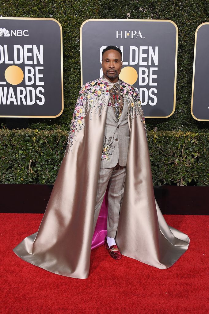 Billy Porter on red carpet in caped suit