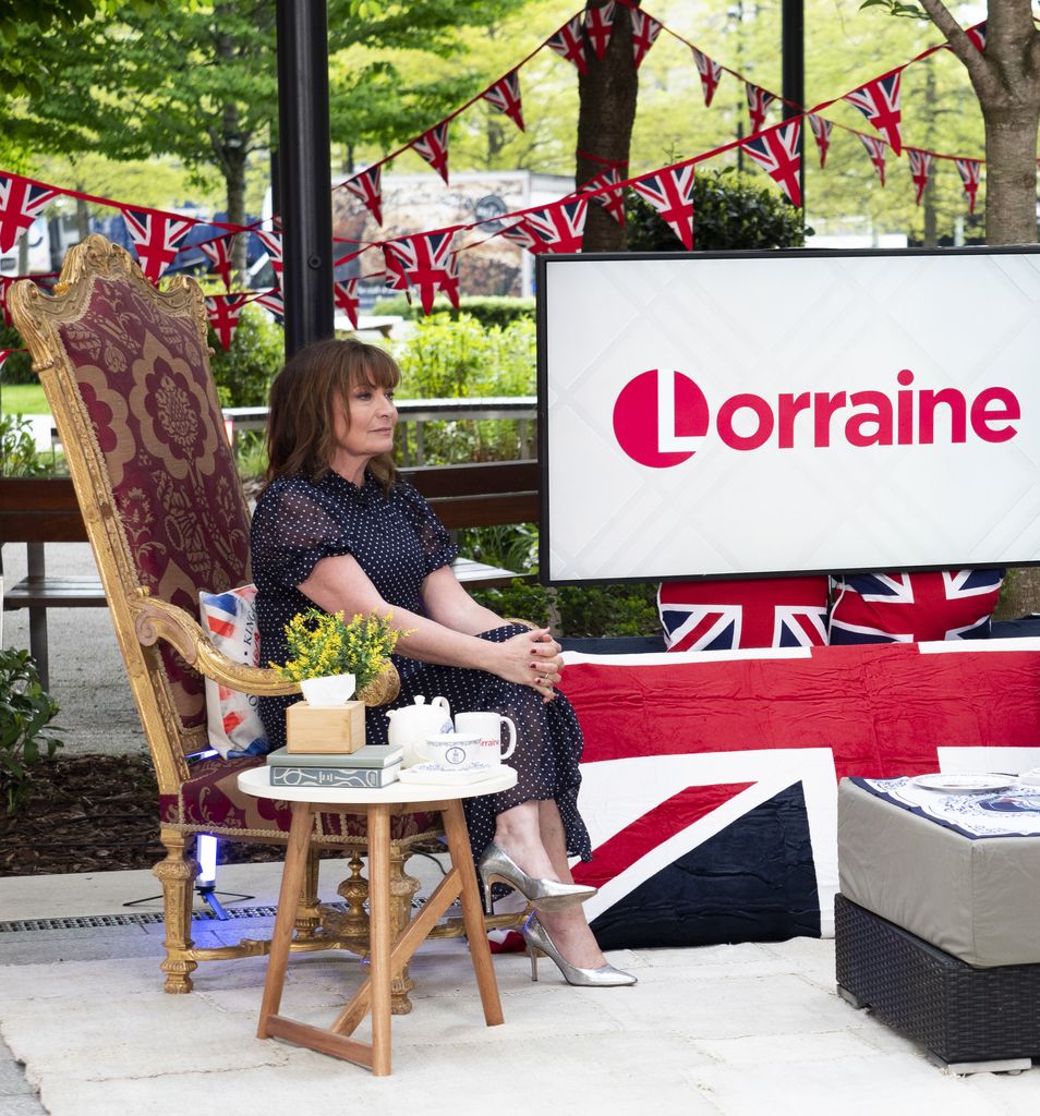 Lorraine Kelly sits cross legged on the throne as she presents Lorraine
