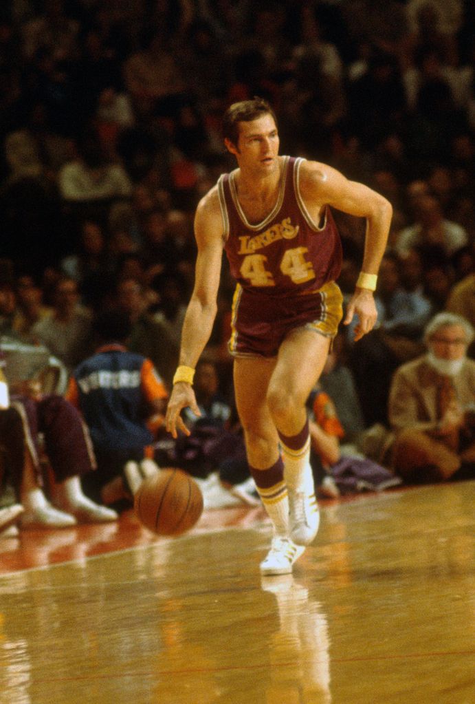 Jerry West #44 of the Los Angeles Lakers dribbles the ball up court against the Baltimore Bullets during an NBA basketball game circa 1972 at the Baltimore Civic Center in Baltimore, Maryland