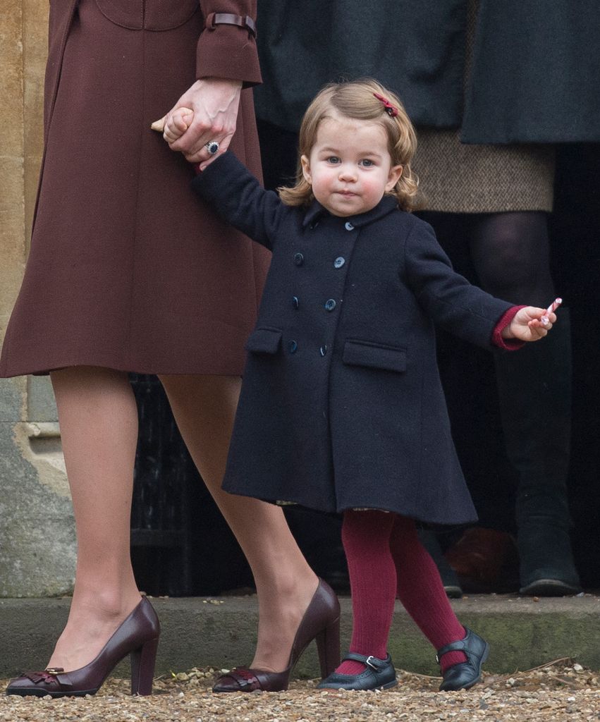 Princess Charlotte at two years old in navy coat  