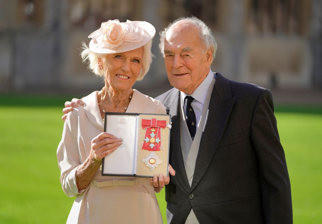 Mary Berry in a cream dress with Paul Hunnings in a black suit