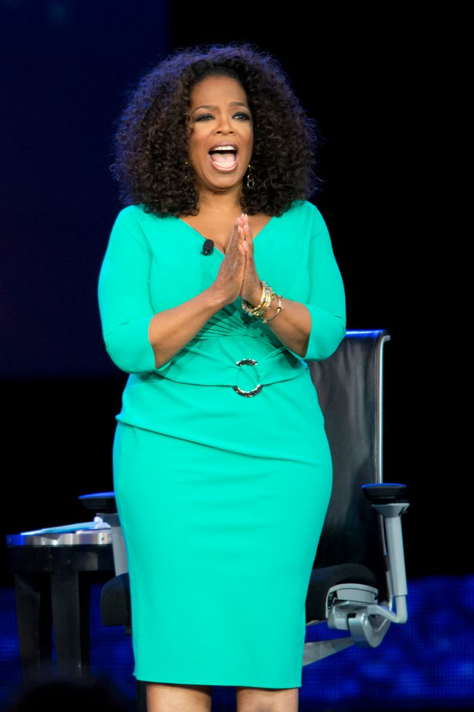 oprah winfrey green dress smiling on stage