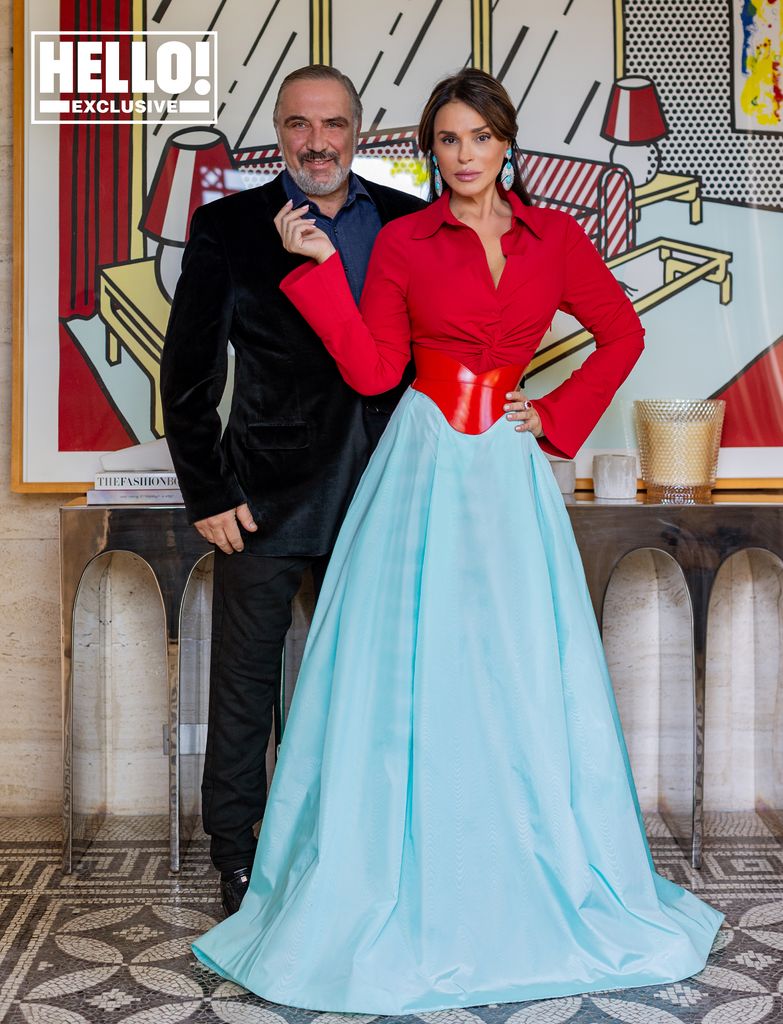 Celia Kritharioti wearing red and blue dress with husband Nikolas Tsakos