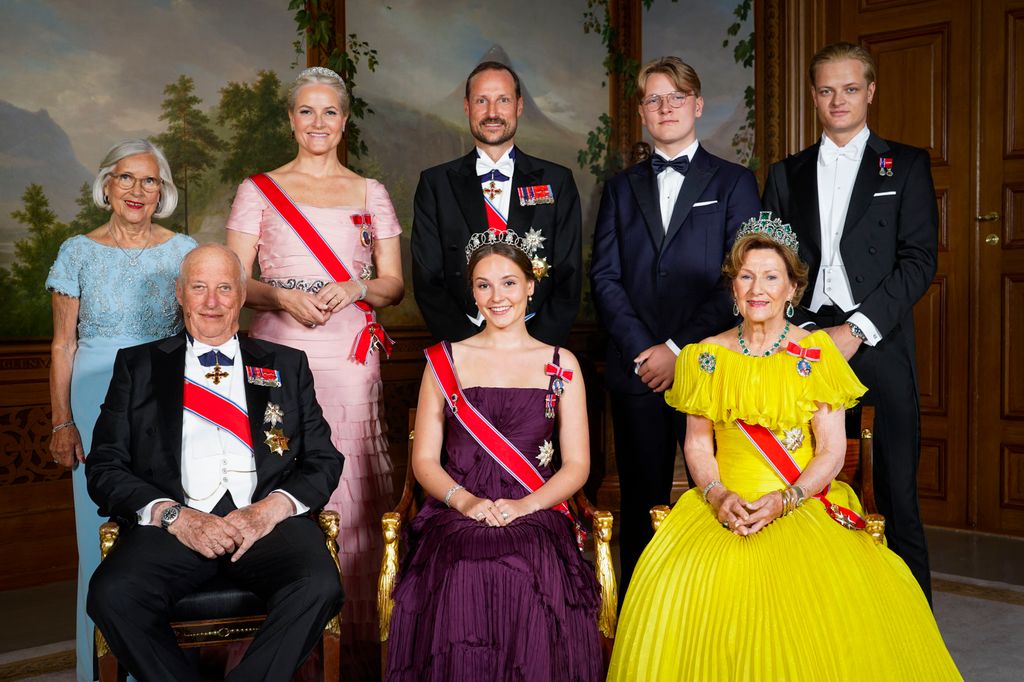 Norway's Princess Ingrid Alexandra (front C) poses for a family photo with (front L and R) Norway's King Harald V and Norway's Queen Sonja and (back LtoR) Marit Tjessem, Norway's Crown Princess Mette-Marit, Norway's Crown Prince Haakon, Norway's Prince Sverre Magnus and Marius Borg Hoiby